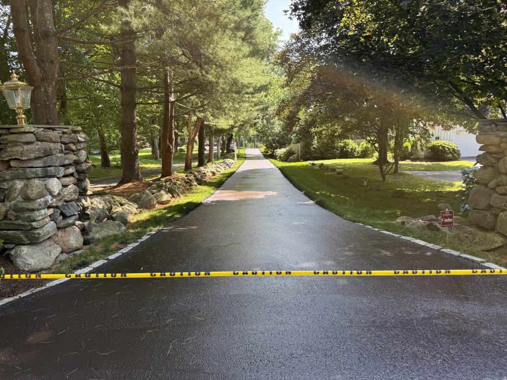 About Fasano's sealcoating: Recently paved driveway showcasing their quality workmanship.